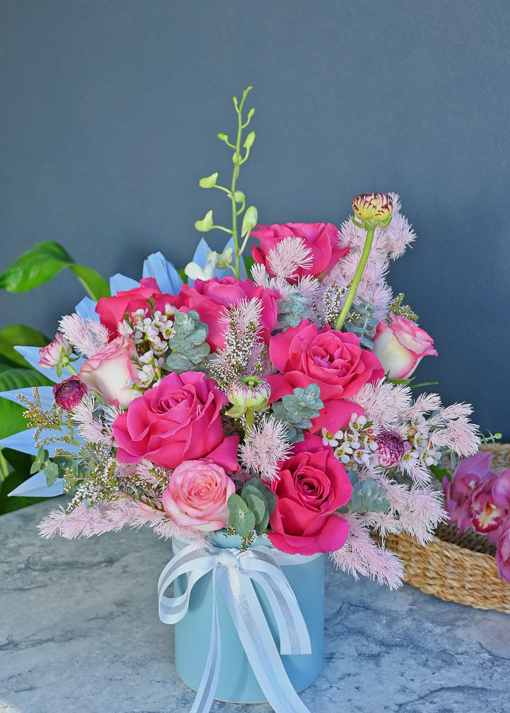 premium roses in ceramic vase