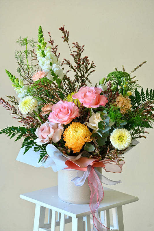 round box flower arrangement