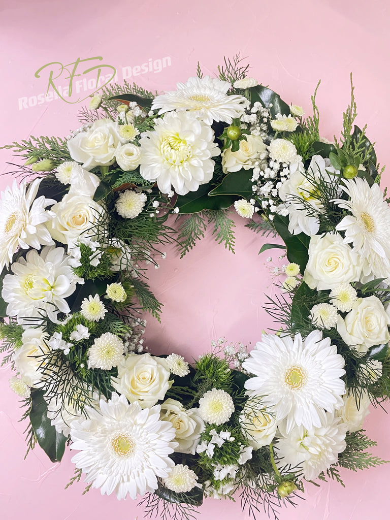 withe green funeral flower wreath