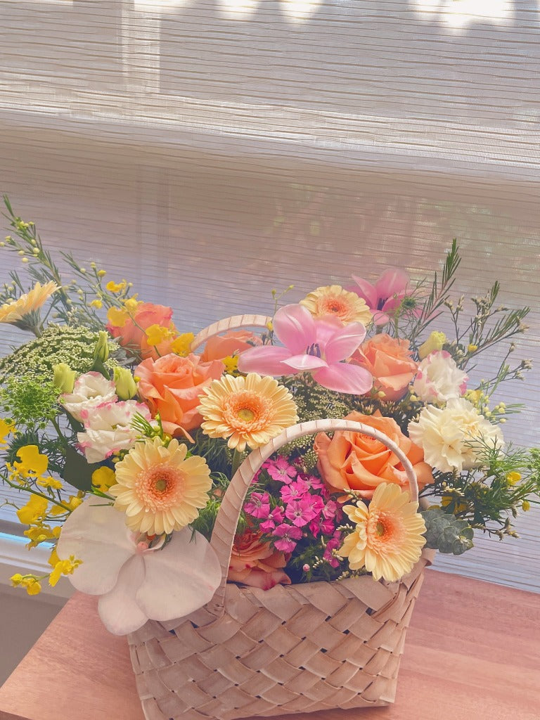 fresh flowers in a basket by florist canberra