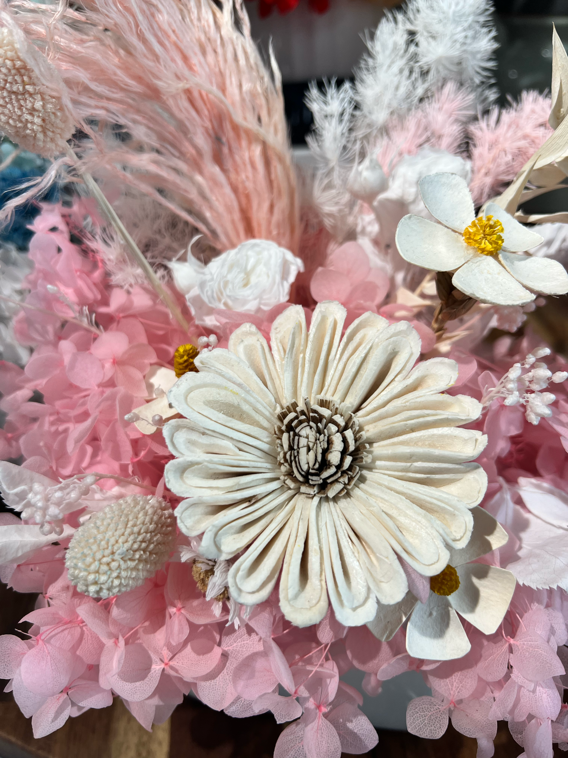 Preserved pink roses with pink and white hydrangeas and coordinating pink everlasting flowers, showcasing premium preserved floral materials for floral design.