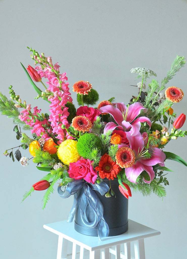 bright colour flowers in round box