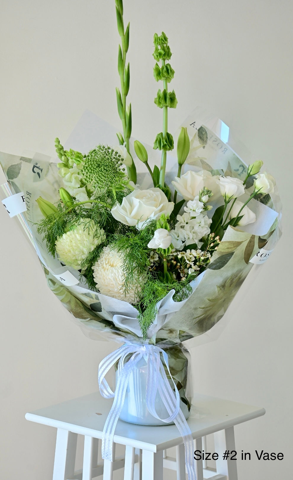 white and green flowers in vase