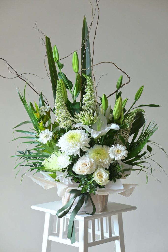 green and white flowers arrangement