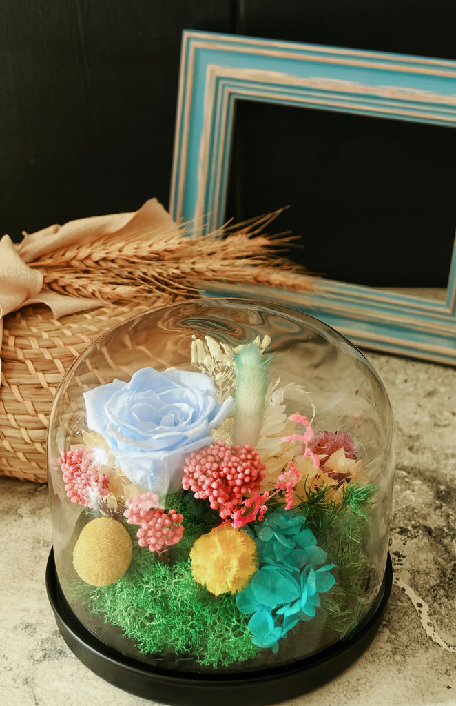 preserved flowers in glass dome