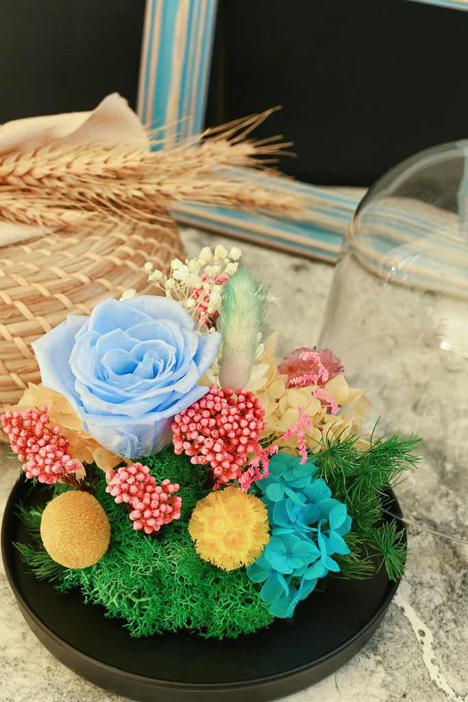 preserved flowers in glass dome base