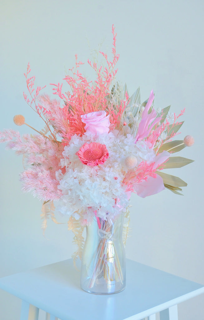 white and pink preserved flowers in vase by rosella florist canberra